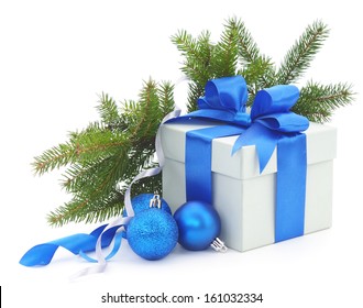 Christmas Gift Box With Blue Ribbon And Fir Branches.