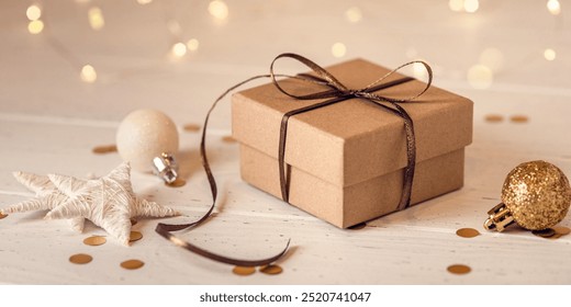 Christmas gift box and decorations on white wooden table. Front view. - Powered by Shutterstock