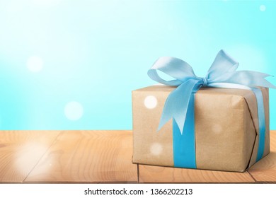 Christmas Gift Box Against Turquoise Bokeh Stock Photo (Edit Now) 519290395