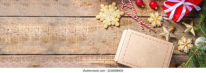 Christmas Gift Box Package. Gift Exchange Christmas New Year Concept On Covid-19 Pandemic. Secret Santa Post Game. Packing Gifts, Cookies In Parcel. Wooden Background, With Xmas Tree Branch And Decor