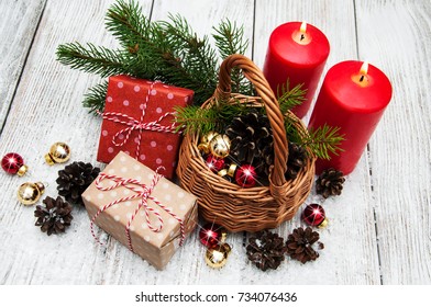 Christmas Gift Boxes And Fir Tree Branch In Basket On Wooden Table