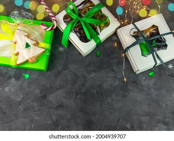 Christmas Gift boxes with set of different dried fruits nuts candied citrus individually wrapped flat lay copy space. Winter holidays celebration. Healthy food diet. Organic eco natural mix top view.