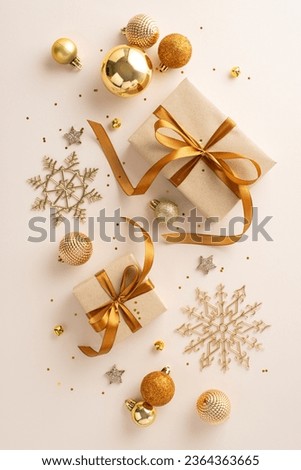 Christmas gift inspiration featuring artisanal gift boxes, ribbon bows, chic orange and gold baubles, shiny stars, snowflake decor, and confetti on a gentle pastel surface. Vertical top view image