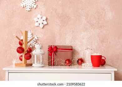 Christmas Gift, Lantern And Decor On Table Near Color Wall