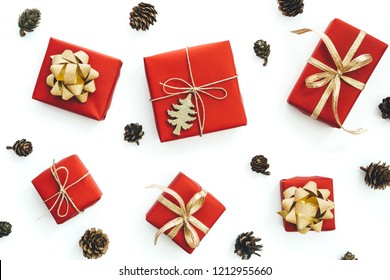 Christmas Gift Wrapped In Red Paper On White Background. Flat Lay.