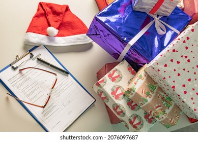 Christmas Gifts Lie On The Table In Modern Santa's Office