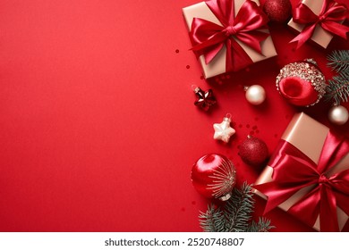 Christmas gifts and ornaments on red background. Xmas greeting card template, Happy New Year banner design. Flat lay, top view - Powered by Shutterstock