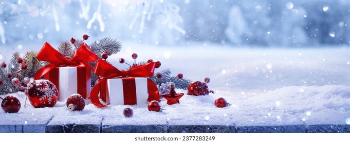 Christmas Gifts With Red Bows On A Winter Forest Background - Powered by Shutterstock