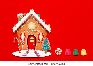 Christmas Ginger Bread House On A Red Background 