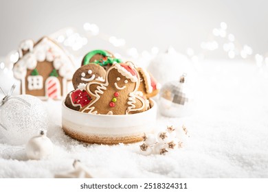 Christmas gingerbread cookies with Christmas decorations on white snow background. Traditional Christmas baking - Powered by Shutterstock