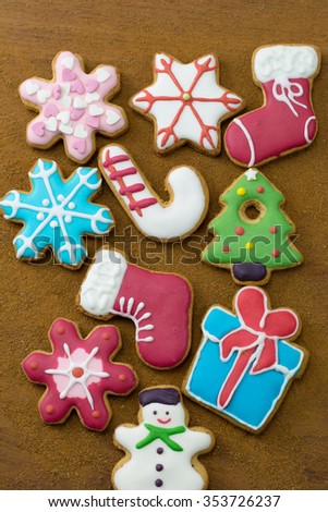 Christmas gingerbread cookies on wooden table.