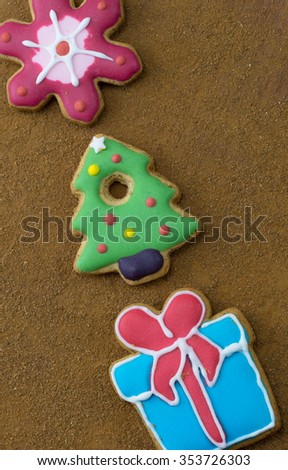 Christmas gingerbread cookies on wooden table.