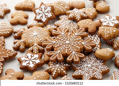 Christmas gingerbread cookies set on white wooden background, close up view - Powered by Shutterstock