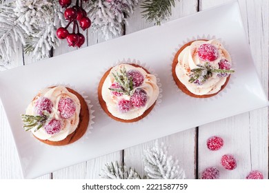 Christmas Gingerbread Cupcakes With Frosty Cranberries. Top Down On A White Wood Table Background With Snowy Branches.