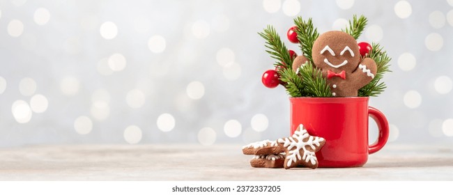 Christmas gingerbread man cookie in red cup. Christmas card - Powered by Shutterstock