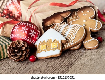 Christmas Gingerbread In Paper Bag On Wooden Table.