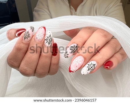 Christmas Glam Pink Almond Nails, Red French Tips, and Festive Black, White Snowflakes | Holiday Nail Art