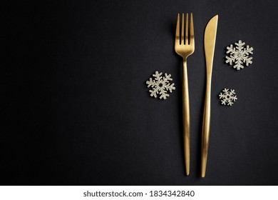 Christmas Golden Cutlery With Snowflake On Dark Background. 