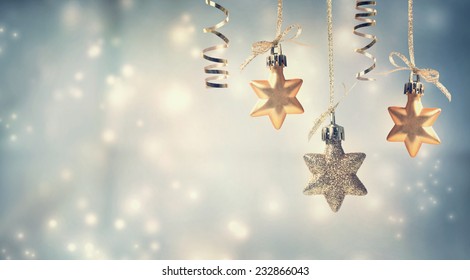 Christmas golden star ornaments in snowy night - Powered by Shutterstock