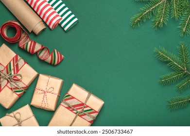 Christmas greeting card, frame, background with fir branches and paper gift boxes and wrapping paper. DIY gifts. - Powered by Shutterstock