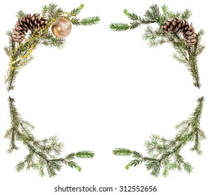 christmas greeting card frame - spruce tree branches with cones and gold ball on white background