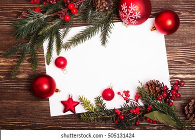 Christmas Greeting Card Or Photo Frame Over Wooden Table.
