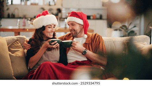 Christmas, happy couple and hug on sofa with hot chocolate, coco and relax in home. Man, woman and eggnog in living room for comfort, warmth and enjoy festive season in winter with love and support - Powered by Shutterstock