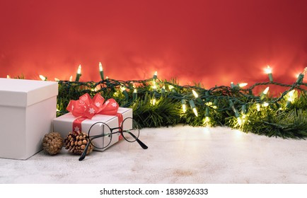 Christmas And Happy New Year Banner With Eyeglasses And Gift Box. 
Space For Text.