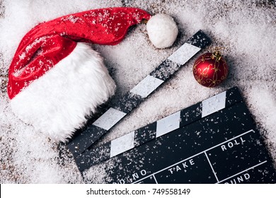Christmas hat with film board in the snow