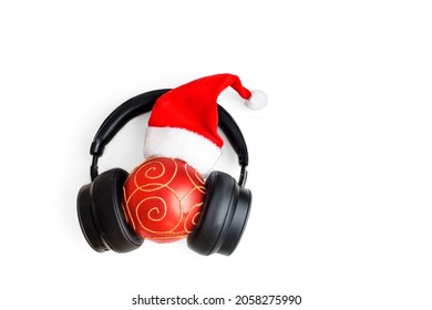 Christmas Hat Headphones And Christmas Ball. Isolate On White Background.
