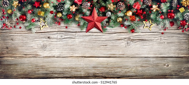 Christmas Header - Border Of Fir Branches And Baubles On Old Wood
