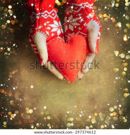 Christmas heart  in woman hands