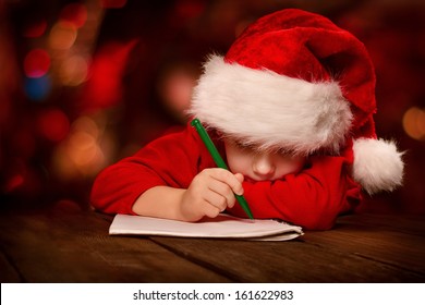 Christmas Helper Child Writing Letter To Santa Claus Letter In Red Hat