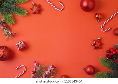 Christmas Holiday Background With Decorations And Ornaments On Red Table. Top View From Above. Flat Lay