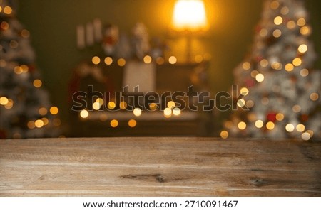 Christmas holiday background with empty rustic table over christmas bokeh background.