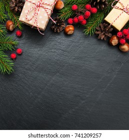 Christmas Holiday Background - Tree  And Decoration On A Black Stone Background