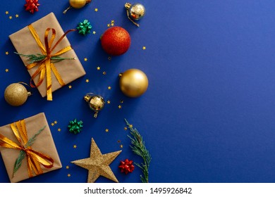 Christmas Holiday Composition. Christmas Decorations, Presents, Baubles On Dark Blue Background With Copy Space. Banner Mockup, Postcard. Flat Lay, Top View, Overhead. Winter Holiday, Xmas Concept.