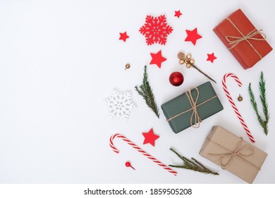 Christmas holiday and happy new year composition and decoration on white background with gift box and pine branches, flat lay, top view and copy space, for banner card - Shutterstock ID 1859505208
