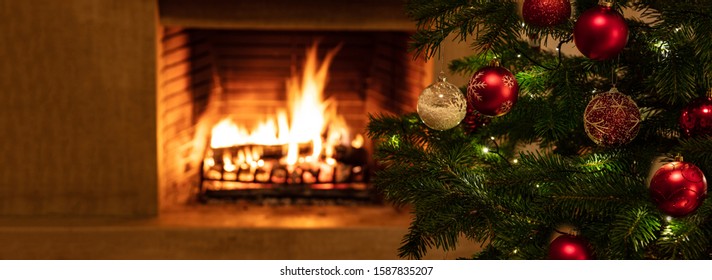 Christmas Holiday Home Background. Warm Cozy Burning Fireplace And Xmas Tree Decorated, Season Greetings Card Template, Banner