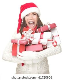 Christmas Holidays Shopping Woman Stress. Shopper Holding Christmas Gifts Stressed, Frustrated And Screaming Angry. Funny Image Of Asian / Caucasian Woman In Santa Hat. Isolated On White Background.