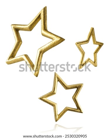 Christmas holliday image, christmas golden bauble in shape of star falling in the air isolated on white background