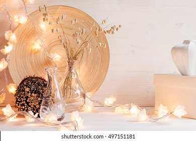 Christmas Home Decoration With Lights On  White Wooden Background. Interior.