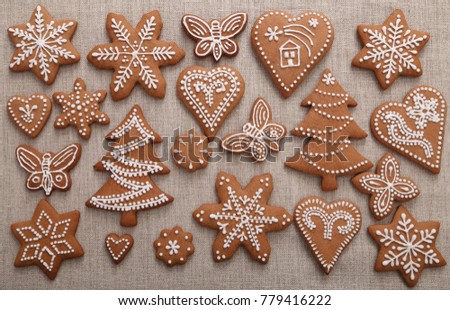 Christmas homemade gingerbread cookies on linen canvas.