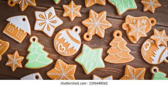 Christmas Homemade Gingerbread House Cookie Over Wooden Background. Sweets As A Gift For The New Year. Free Space Free Space Greetings