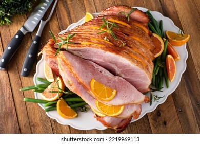 Christmas Honey Orange Glazed Ham Served On A Plate With Green Beans Overhead View