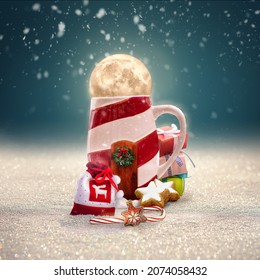 Christmas House Made From A Cup Filled With Holiday Cheer. A Festive Cup Of Hot Coco With Christmas Decorations ,sweets, Gifts, A Candy Cane And A Lot Of Snow For A Great Festive Time! 