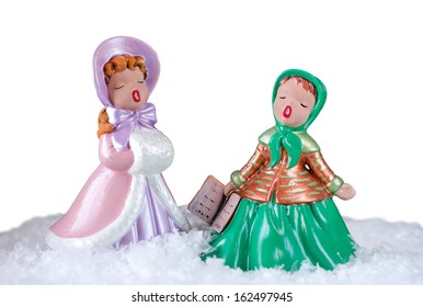 Christmas Image Of Two Beautiful Vintage Carol Singers Over White Background