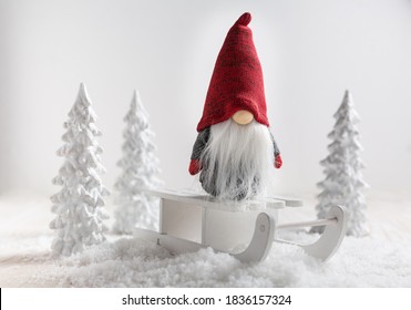 Christmas imp on sleigh with snowy landscape. Christmas decoration. - Shutterstock ID 1836157324