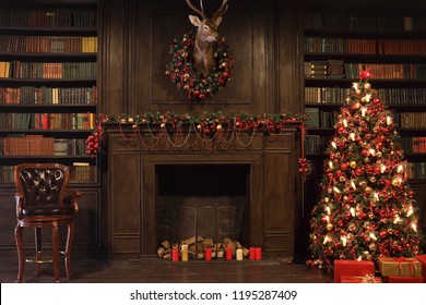 Christmas interior with bookshelves, stuffed deer, wooden fake fireplace, christmas tree, boxes, chair in studio - Shutterstock ID 1195287409