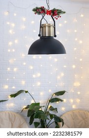 Christmas interior of a loft-style house with a black decorated retro lampshade and indoor plants of Strelitzia nicolai. New Year, comfort at home - Shutterstock ID 2232381579